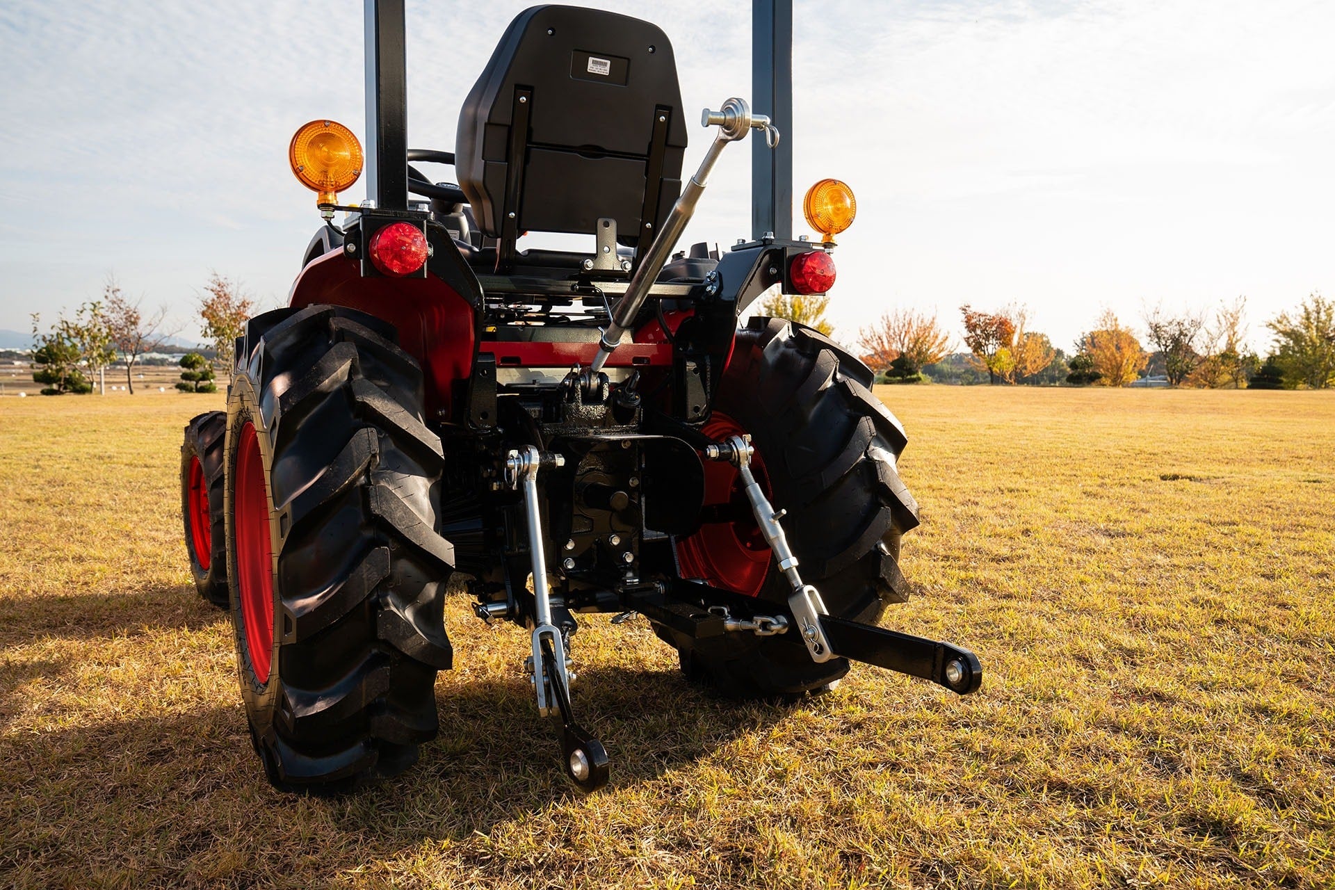 TYM compact tractor working in an open field
